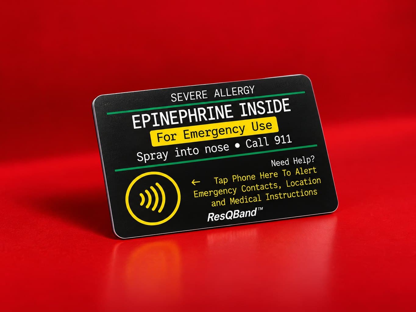 The black ResQBand Tap Card for neffy standing on a red studio set: severe allergy, epinephrine inside, for emergency use, spray into nose, call 911, need help? tap a phone here to alert emergency contacts, location and medical instructions
